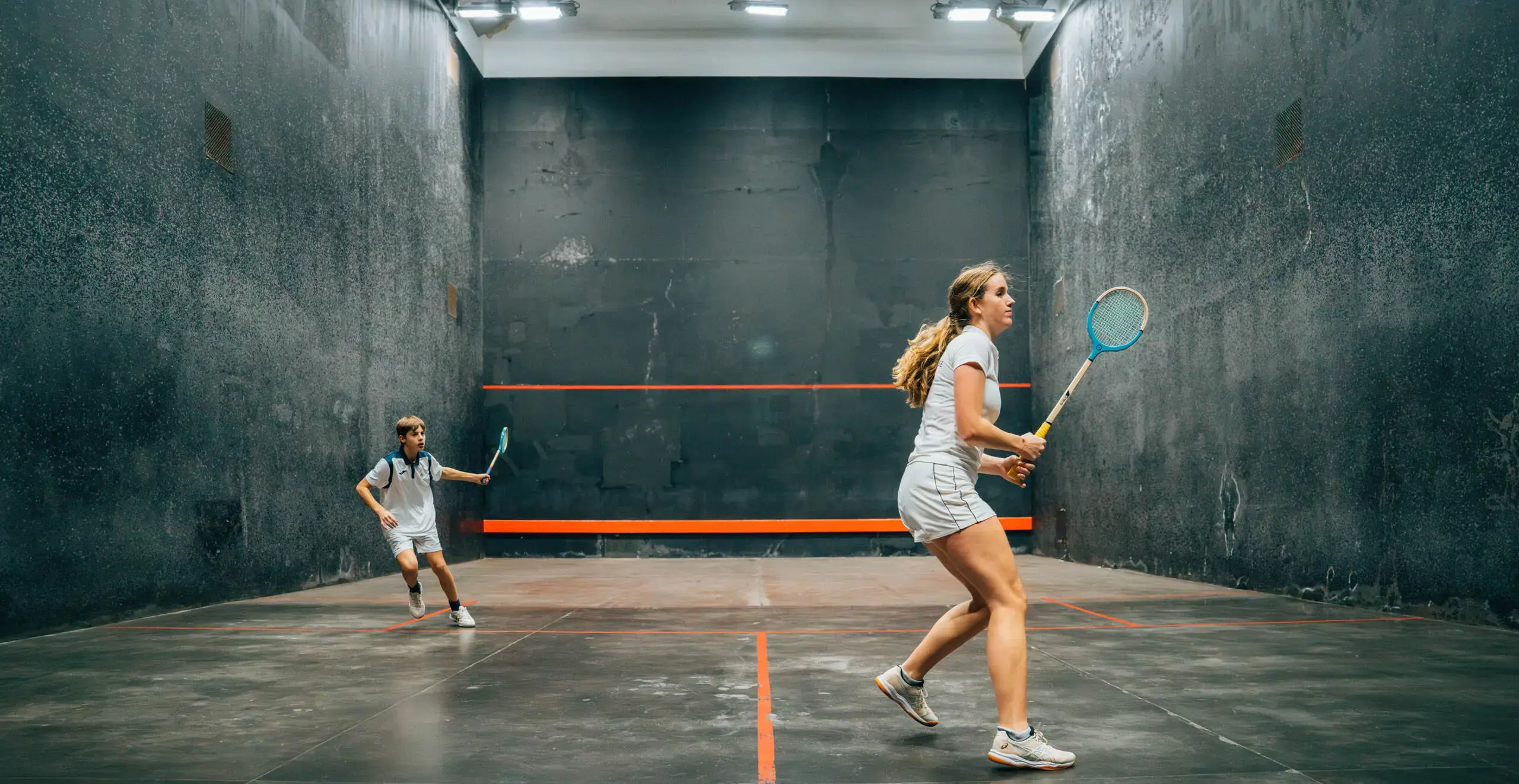 Student athletes playing squash